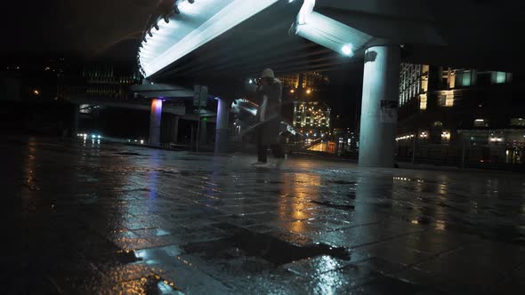 The Girl is Waiting Looks at the Clock at Night in the City alt