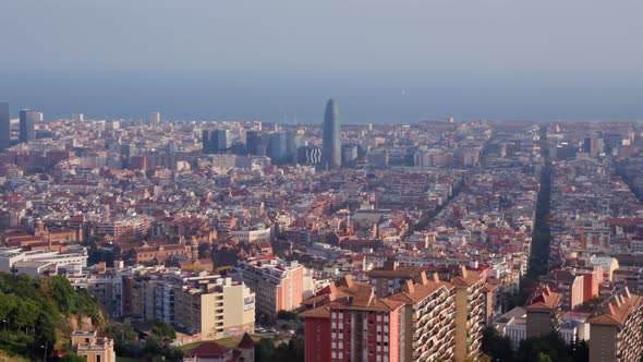 Panning panoramic shot over polluted barcelona skyline, famous mediterranean city in Spain. beautifu alt