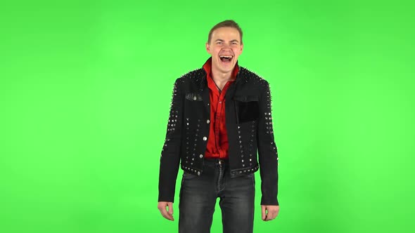 Guy Bursting with Laughter Being in Positive Over Green Screen alt