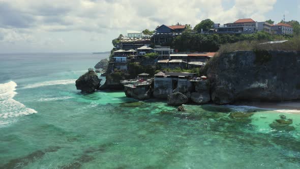 Aerial Drone Flight Over Cliff at Suluban Beach Bali Indonesia alt