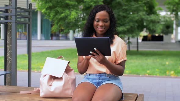 Happy African Student Girl with Tablet Pc in City alt