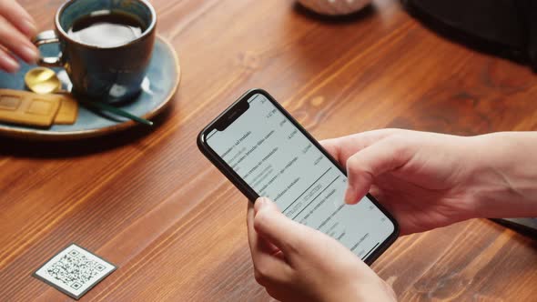 Woman Using Online Menu in Cafe Closeup Scanning Qr Code with Smartphone in Restaurant alt