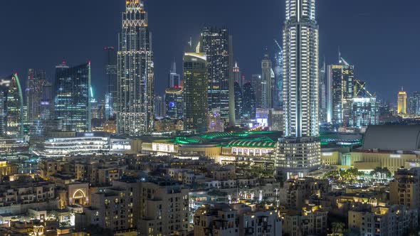 Aerial Nighttime Cityscape with Illuminated Architecture of Dubai Downtown Timelapse United Arab alt