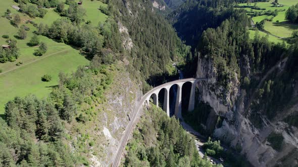 Landwasser Viaduct in Swiss Alps in Summer Aerial View on Green Mountain Valley alt