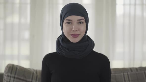 Close Up Portrait of Successful Confident Young Muslim Business Woman Looking at Camera Smiling alt