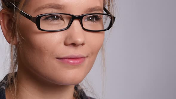 Closeup portrait of young woman on white background