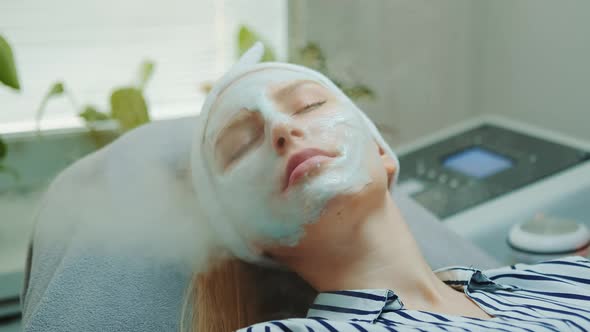 Close-up Shot of Professional Facial Skin Care Treatment with a Cosmetic Steamer at Beauty Salon alt