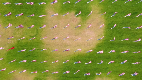 The Waves Of Flags Display At Alumni Park At Pepperdine University In Malibu - aerial top down alt