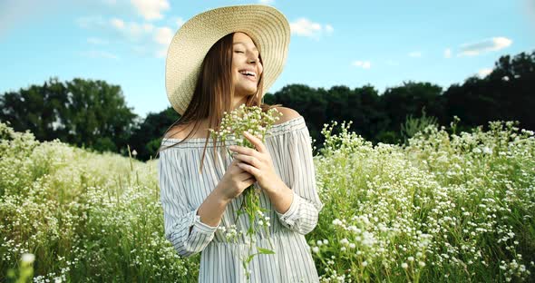 Portrait of Happy Woman With Flowers