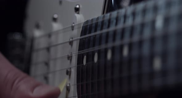 Close Up Of Vibrating Strings On A Guitar