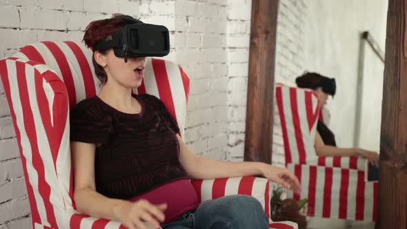 Woman Playing Game in Virtual Reality Glasses alt