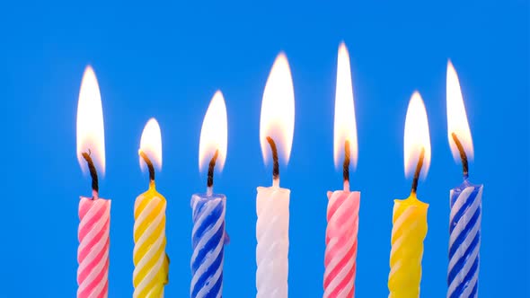 Collection Set of Birthday Candles on Blue Background Making a Wish