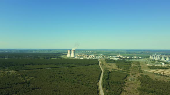 Nuclear Power Station with Two Smoking Cooling Towers alt