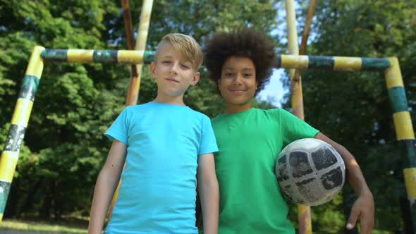 Multiethnic Team Mates With Football Smiling and Looking at Camera, Hobby