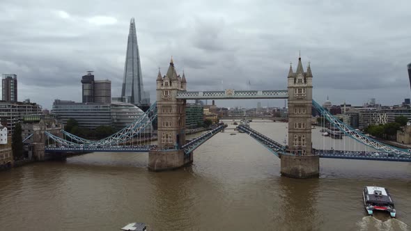 A Drone View of a Boat Ride on the River Thames Under Tower Bridge