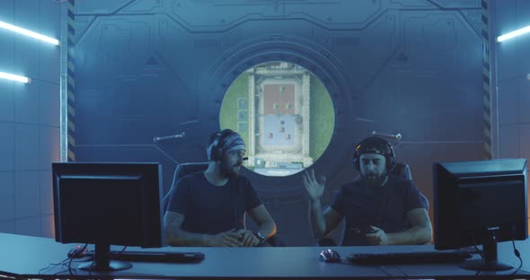 Young Men Playing a Match at a Gaming Tournament alt