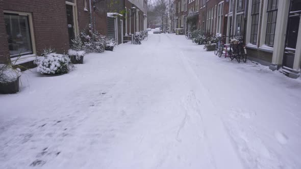 Leiden city residential streets in winter snow, Netherlands winter, tilt reveal alt