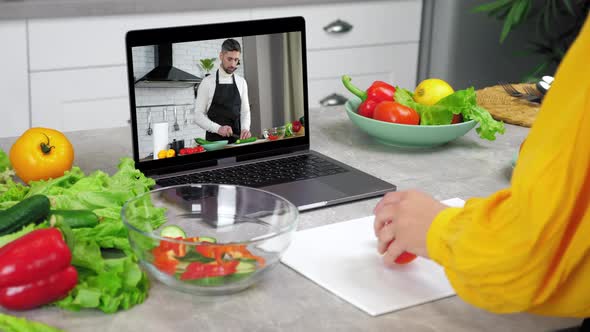 Man Food Blogger in Laptop Screen Tells Teaches Housewife Remote Cooking Course alt