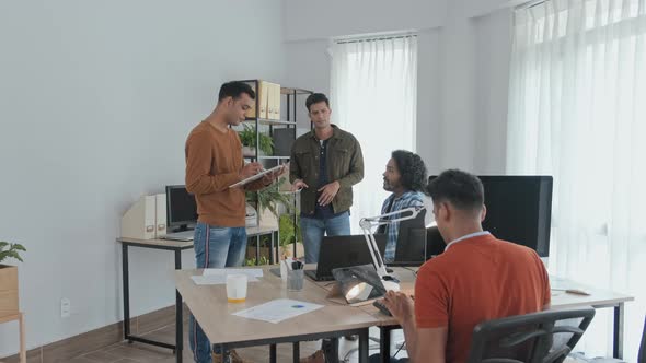 Team of Programmers Brainstorming in Office alt