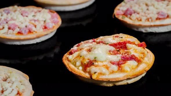 Cinemagraph Timelapse  One of Many Mini Pizzas Baking in Electric Oven at Home