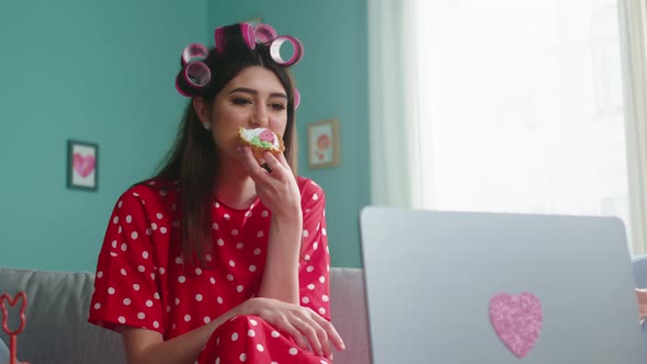 Stylish Woman Eats Cake Watching Movie alt