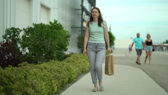 Woman Walking with Shopping Bags From the Mall