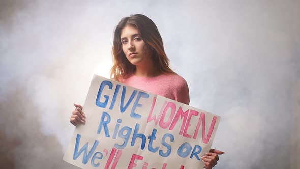 Portrait of Confident Feminist Girl in Smoky Space alt
