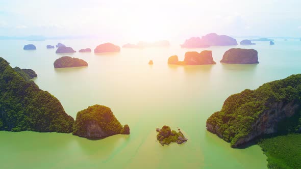 Aerial view from a drone over many islands at Phang Nga Bay during sunset time alt