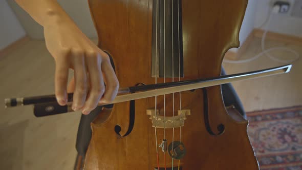 Musician playing the cello slowmotion