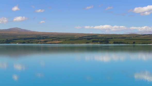 Lake landscape, clouds reflection on water at Lake Pukaki, New Zealand alt