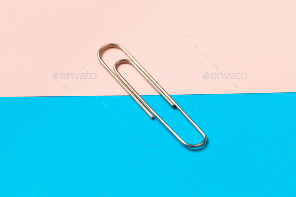 metal paper clips and paper on paper background - Stock Photo - Images