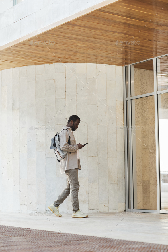 African American Businessman Entering Office Building
