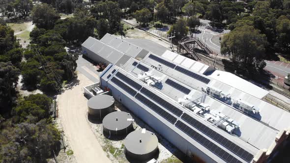 Aerial View of a Warehouse with Solar Panels in Australia
