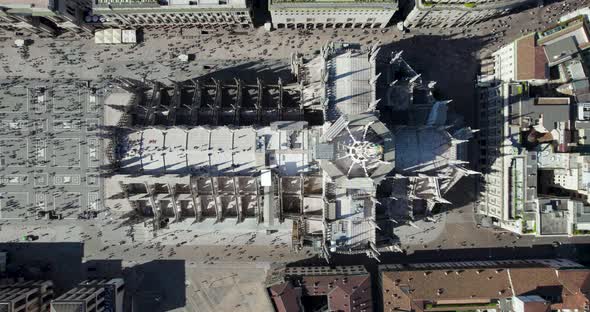 Top-down aerial view of iconic Milan Cathedral and Piazza Duomo, Italy alt