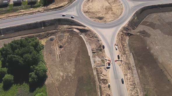 Top down aerial view of a new traffic roundabout. Construction business.
