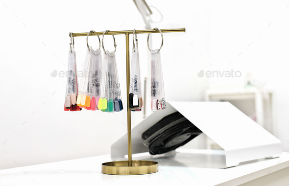 color palette of gel polish colors on a t-stand in beauty salon.