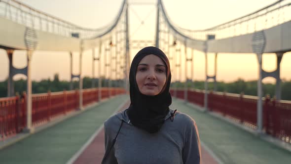 Pretty Arab Woman in Hijab During Jogging Exercise alt
