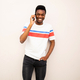happy young African American man talking with cellphone by white background - PhotoDune Item for Sale