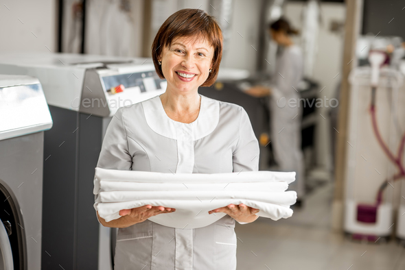 Senior washwoman in the laundry