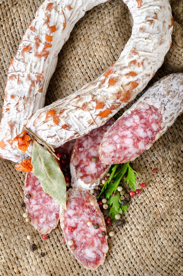 Salami sausage on a canvas - Stock Photo - Images