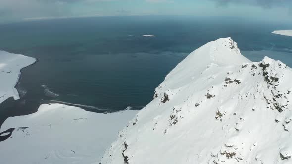 Bird's-eye View of the Snowy Mount Kirkjufetl. Iceland, Winter 2019