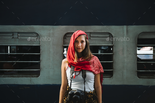 Western female traveler standing at a railway station in Varanasi