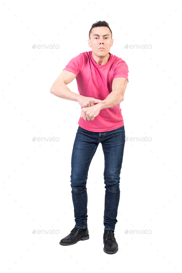 Unsatisfied man pointing on wrist due to late