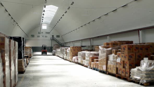 Forklift Truck at a Large Warehouse. alt