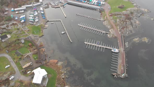 Empty Marina and Winterized Boats Top Down Aerial Forward