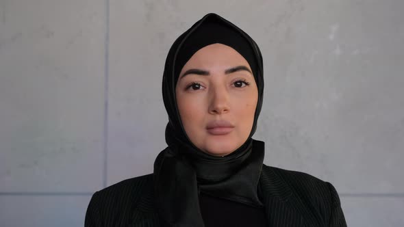 Muslim Arabian Independent Woman in Hijab Looking at Camera