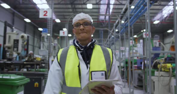 Warehouse female worker working   alt