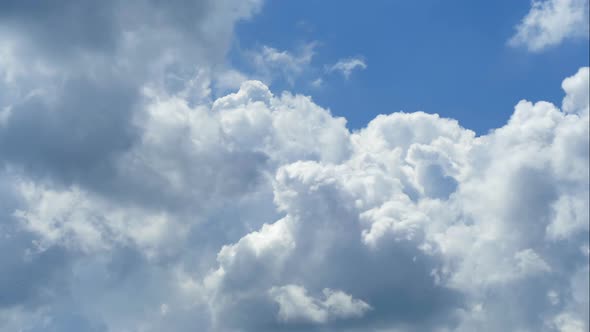 White and Beautiful Clouds Swirl in the Blue Sky