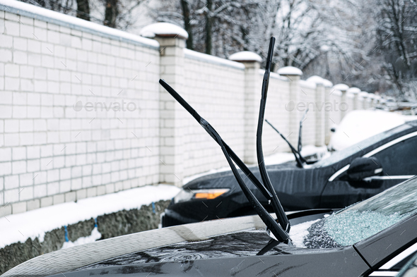 Windshield wiper raised up and icy car windshield. Leave Windshield Wipers  Up in the Ice and Snow Stock Photo by IrynaKhabliuk