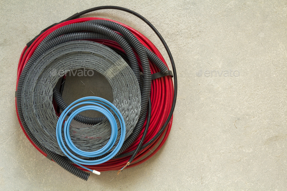Heating floor system wires and cables. Renovation and construction concept. Comfort house